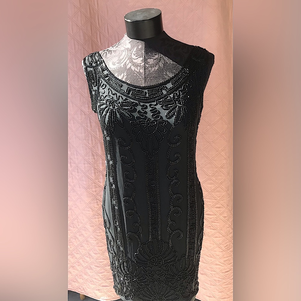 Exquisite Designer DKNY size four all silk sequin embellished dress!